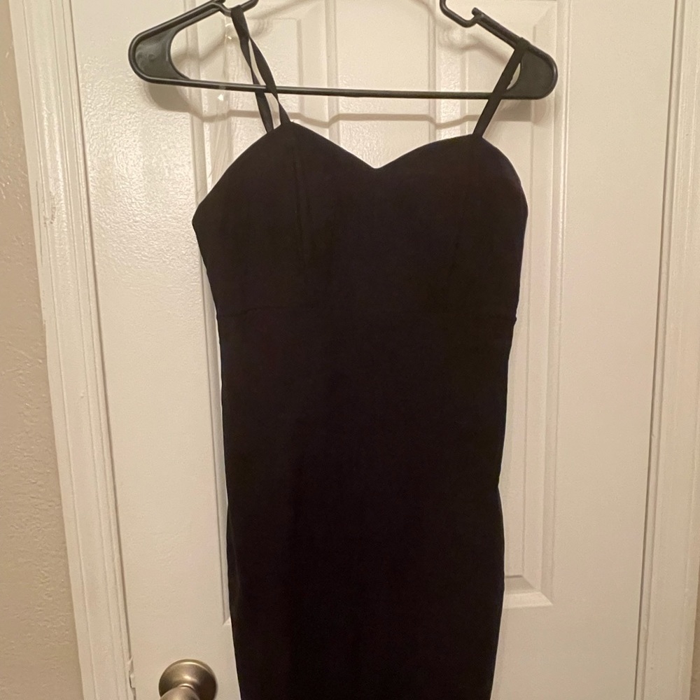 Fashionnova Form fitting black dress with see through feature on the bottom